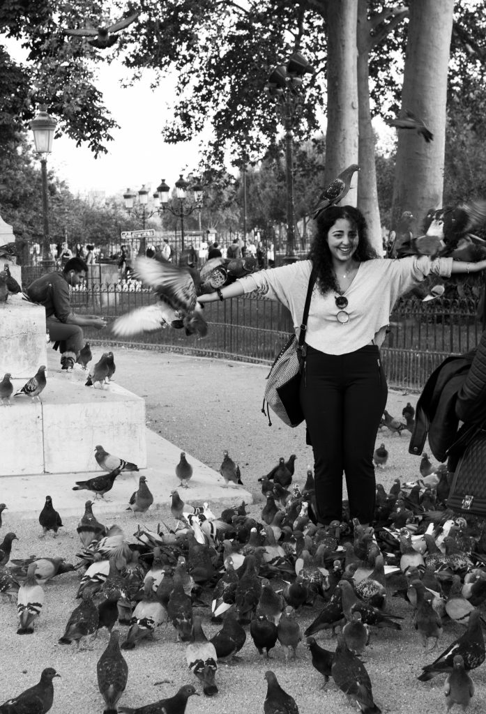 Girl with pigeons Notre Dame