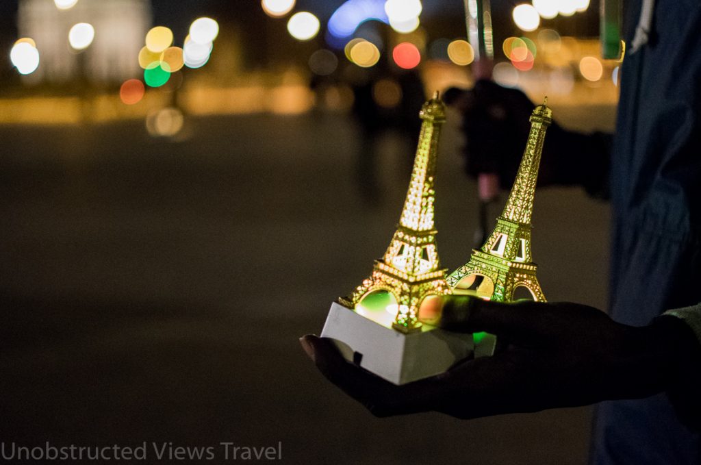 People will try to sell you all kinds of mini Eiffel Towers and souvenirs outside the pyramid